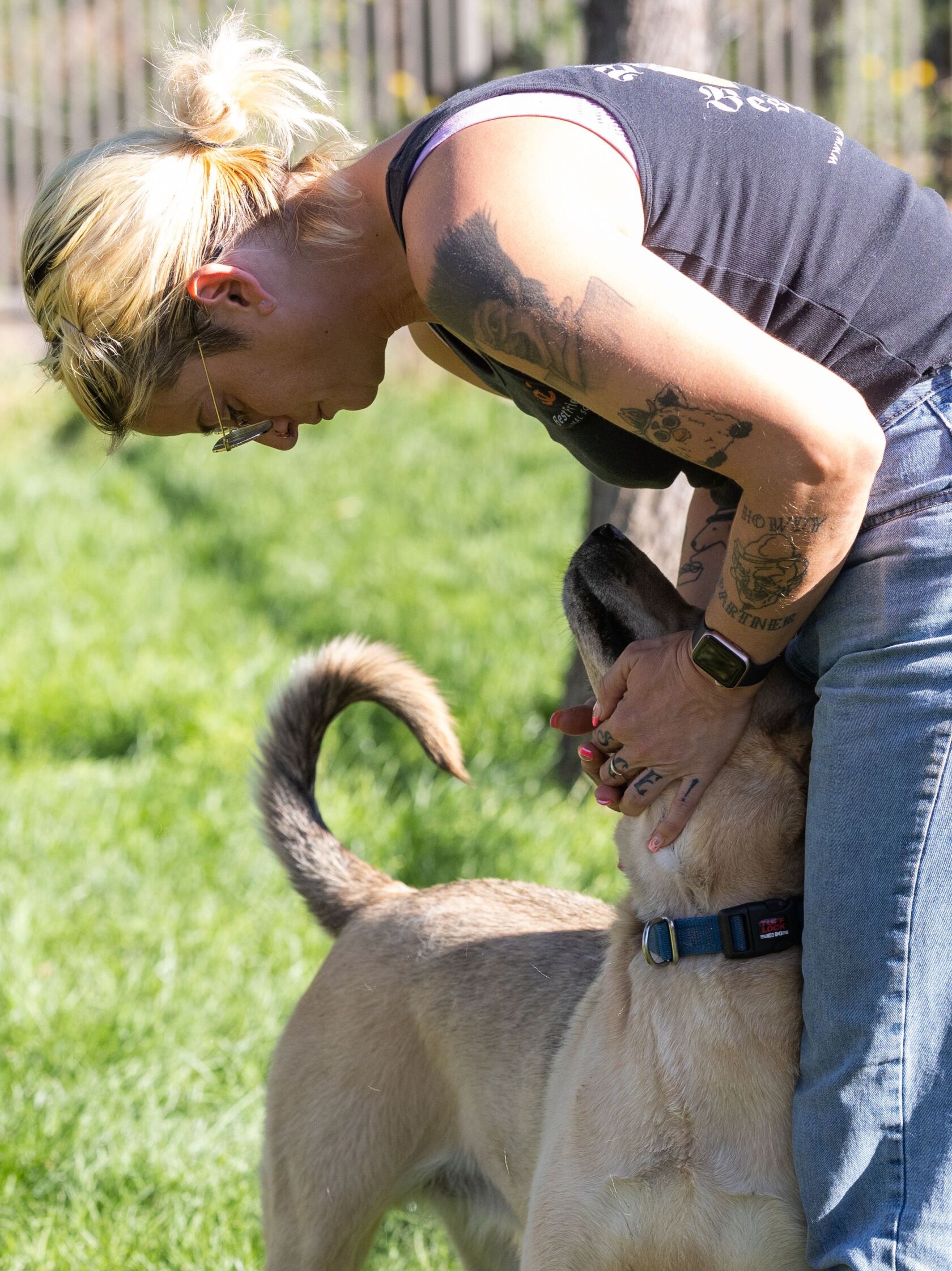 Melissa McCormic, senior manager of behavior, pets Lucky Lucy during playgroup at Best Friends Animal Sanctuary in Kanab on Thursday, July 27, 2023.