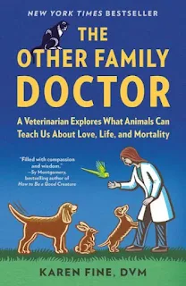 The cover of the book The Other Family Doctor shows a woman vet greeting a group of animals, including dogs. A cat looks on from above.