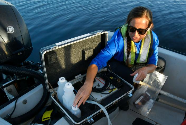 Carolyn Vanzo, environmental scientist II. Environmental scientists with the St. Johns River Water Management District conduct routine tests for toxic algae in Lake Washington, which is the main source of drinking water for the city of Melbourne. There were no signs of an algae bloom on the day of this test, but scientists want to know whether toxic algae blooms are happening more frequently or in higher concentrations in the lake.