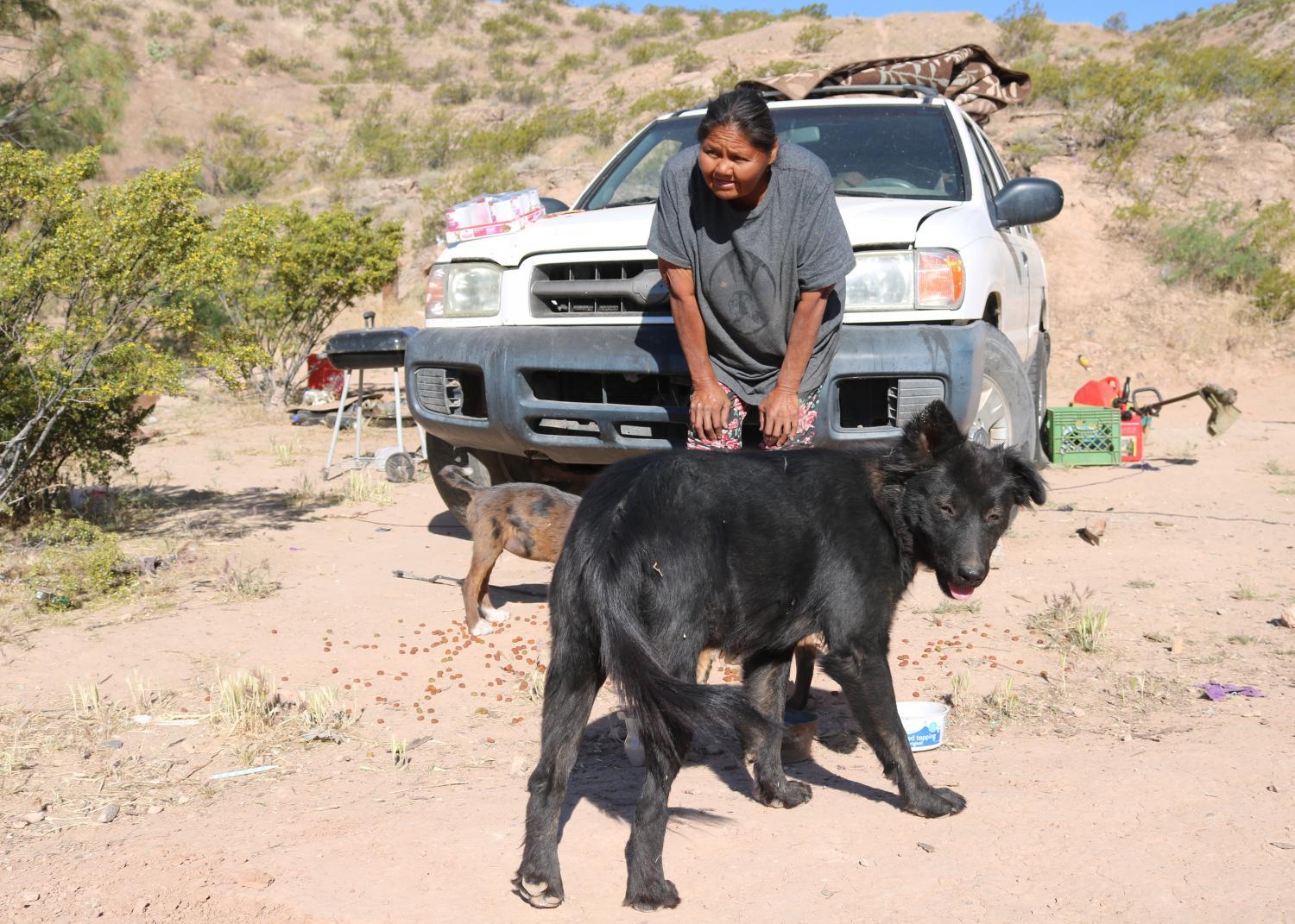 Darlene McIntosh tries to call over her stray pets as the Geronimo Animal Rescue Team made a daily check-up visit in late-April 2024.