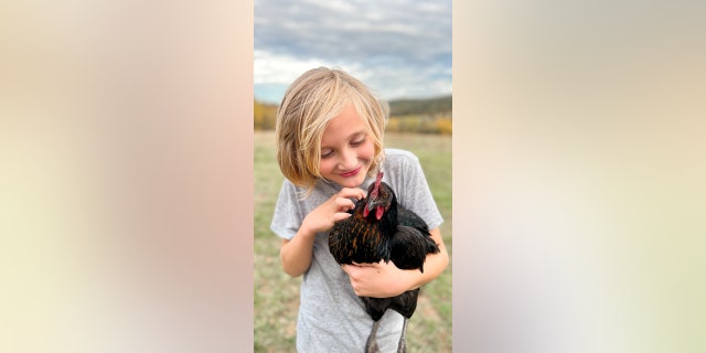 Clark's son Fin, who is nine years old, loves to help out around the farm. 