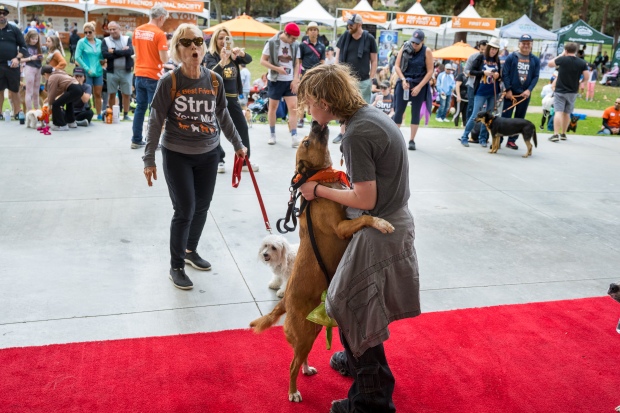 Bailey Watson gets a dog kiss from “Lucy” and wins...